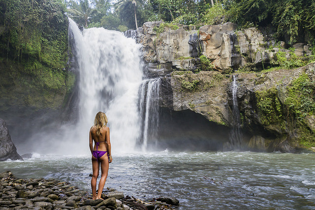 Young woman at Tegenungan Waterfall near Ubud